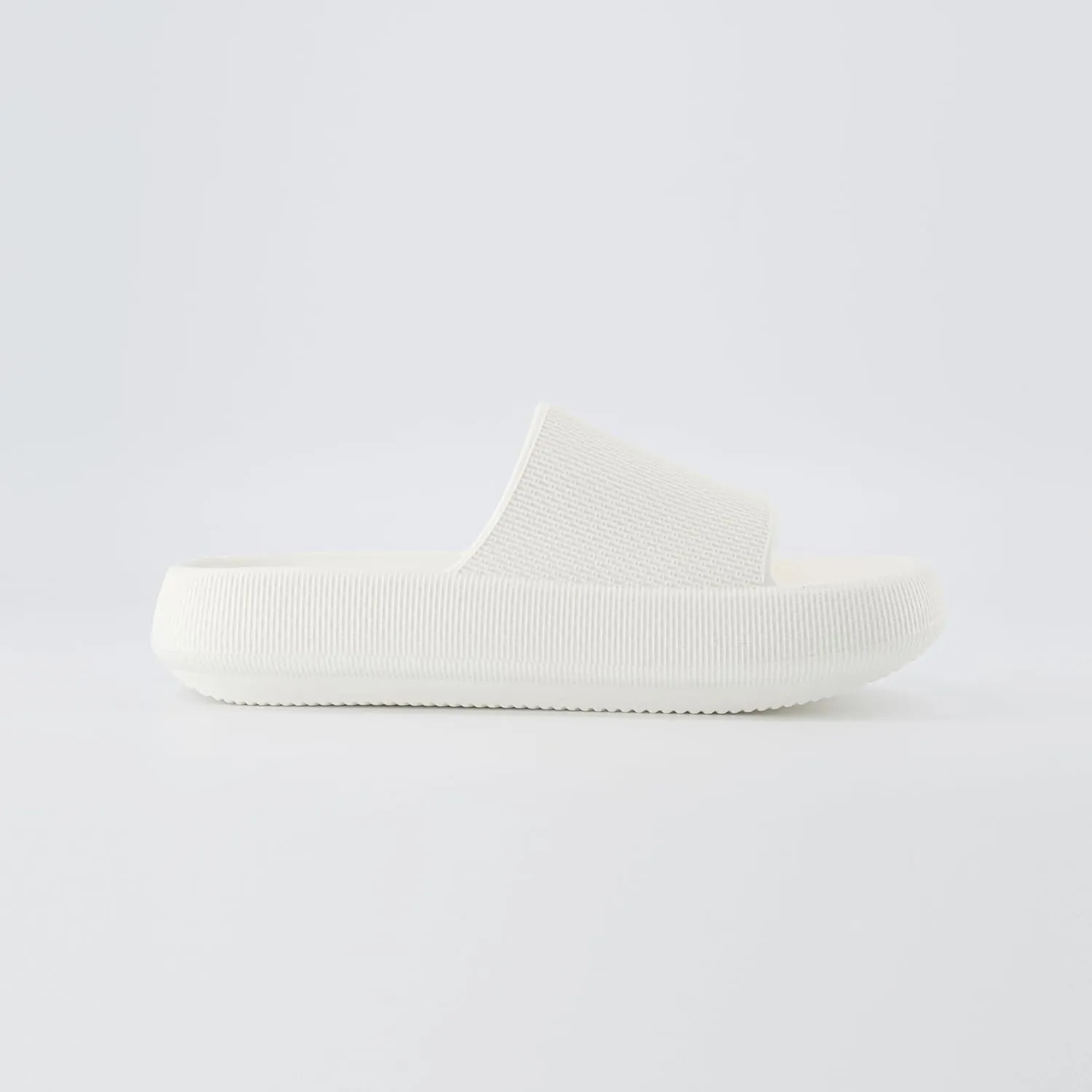 CUSHIONAIRE Feather Slides – Comfortable Cloud Cushion House Slippers for Women, Indoor Outdoor EVA Foam Foot Spa Shower Shoes, Non-Slip Arch Support